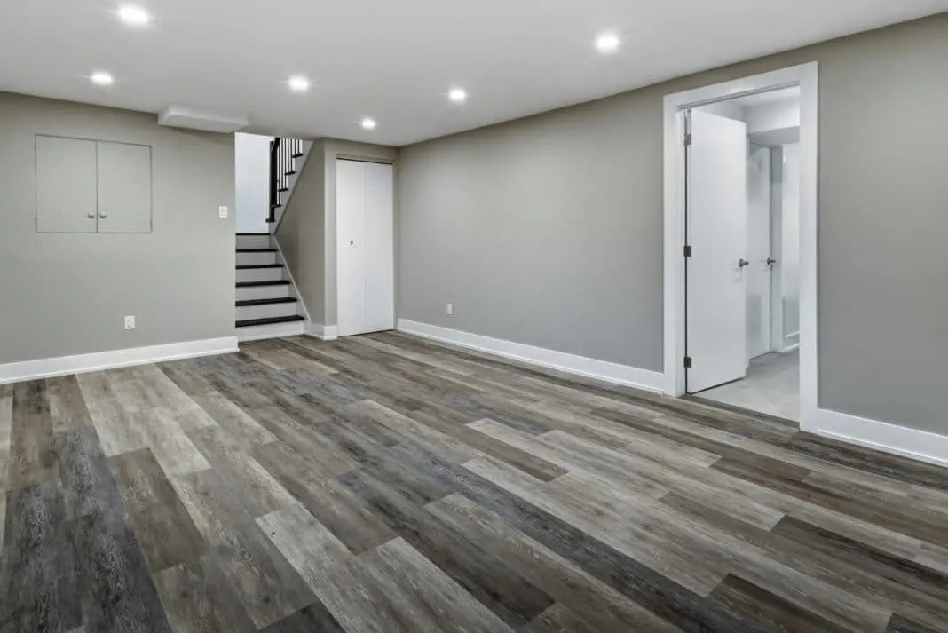 A Basement Finish|Remodel with wood floors and stairs.